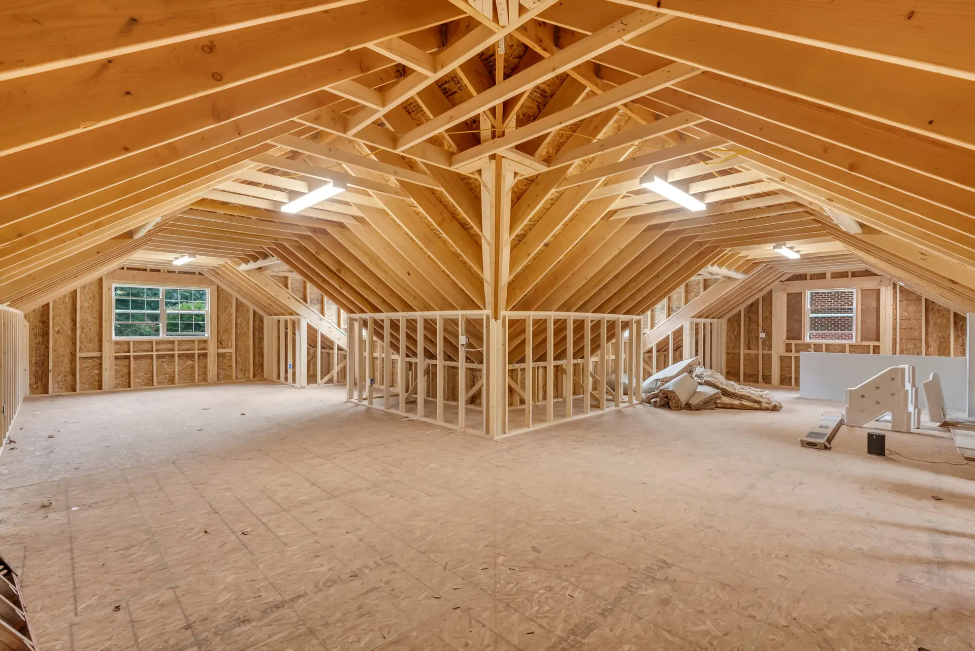 Rough framing and roof trusses of a Northern Virginia garage addition ready for the county framing inspection